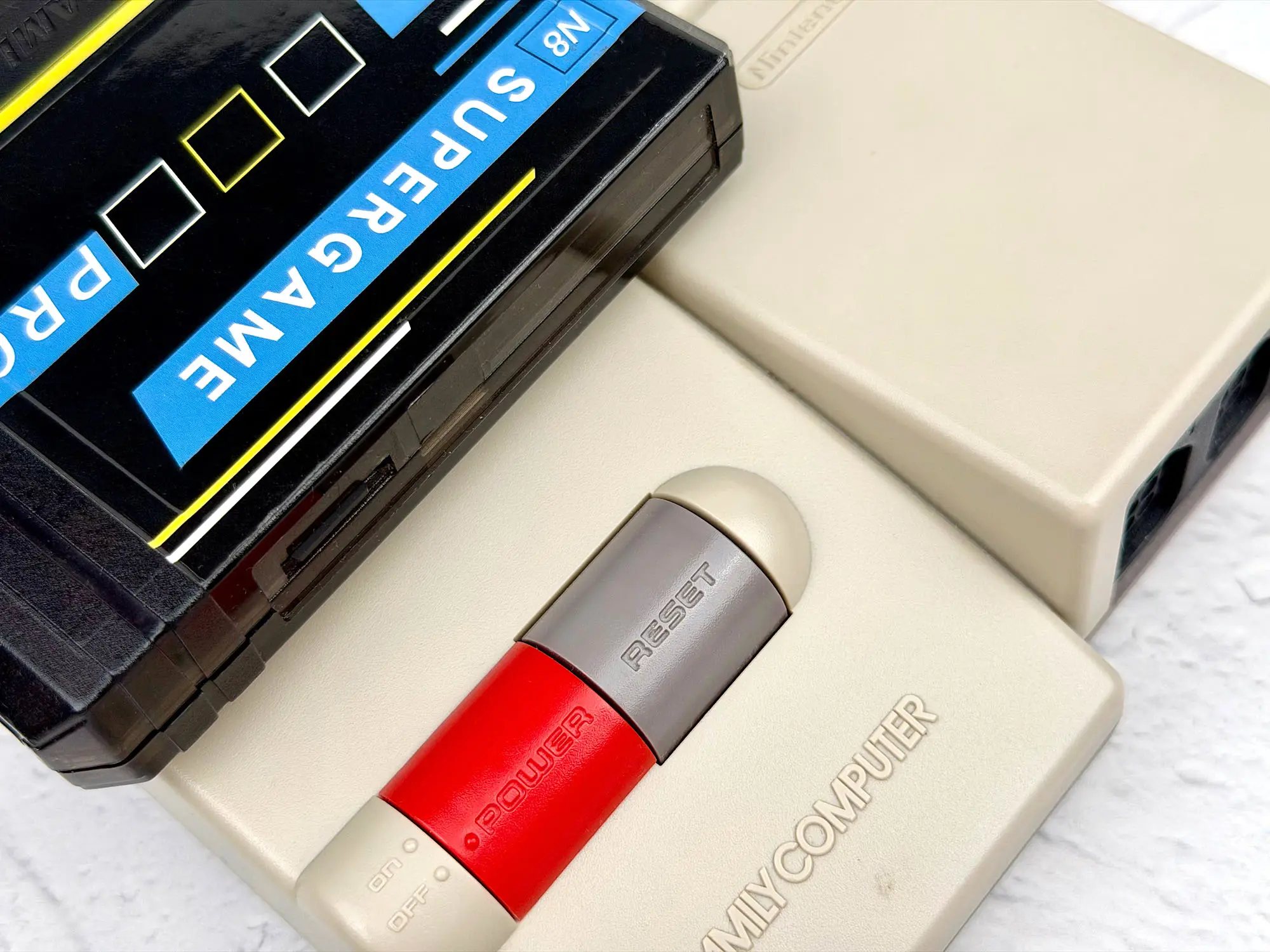 Reset button on the console Reset button on the console