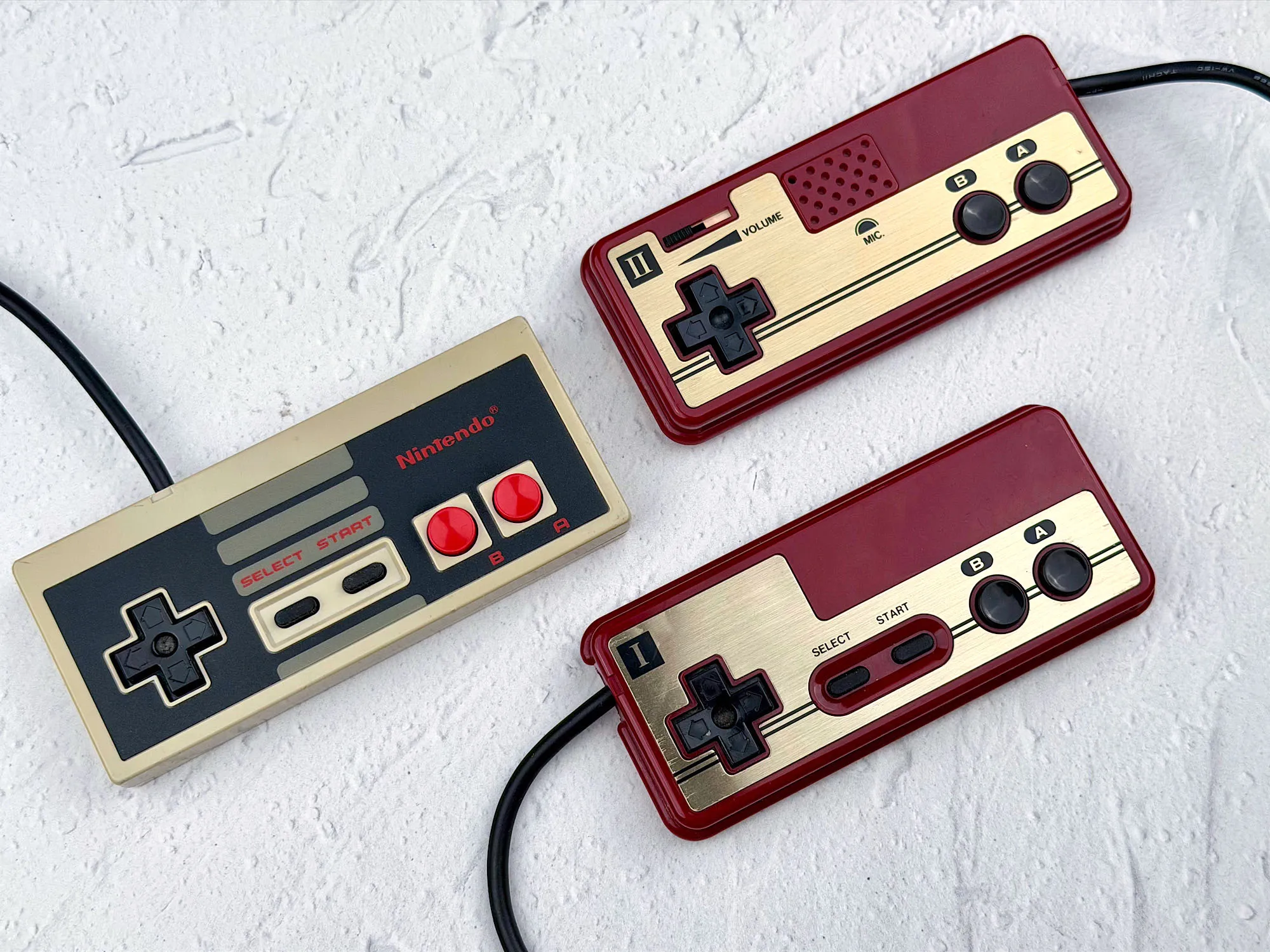 Controller comparison: Famicom and two NES pads Controller comparison: Famicom and two NES pads