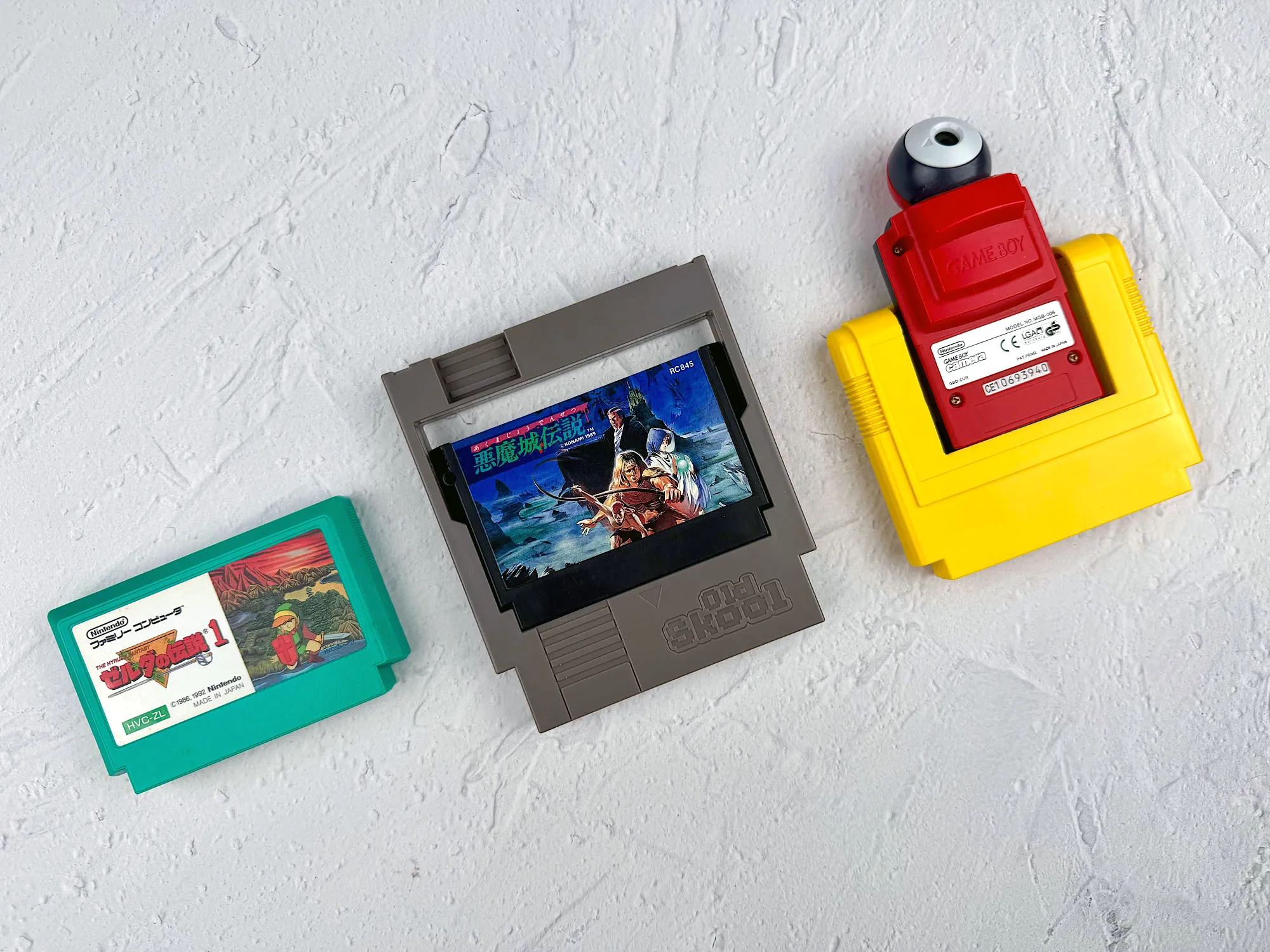 Comparison: Famicom cartridge, adapter in NES, and a large Game Boy adapter Comparison: Famicom cartridge, adapter in NES, and a large Game Boy adapter