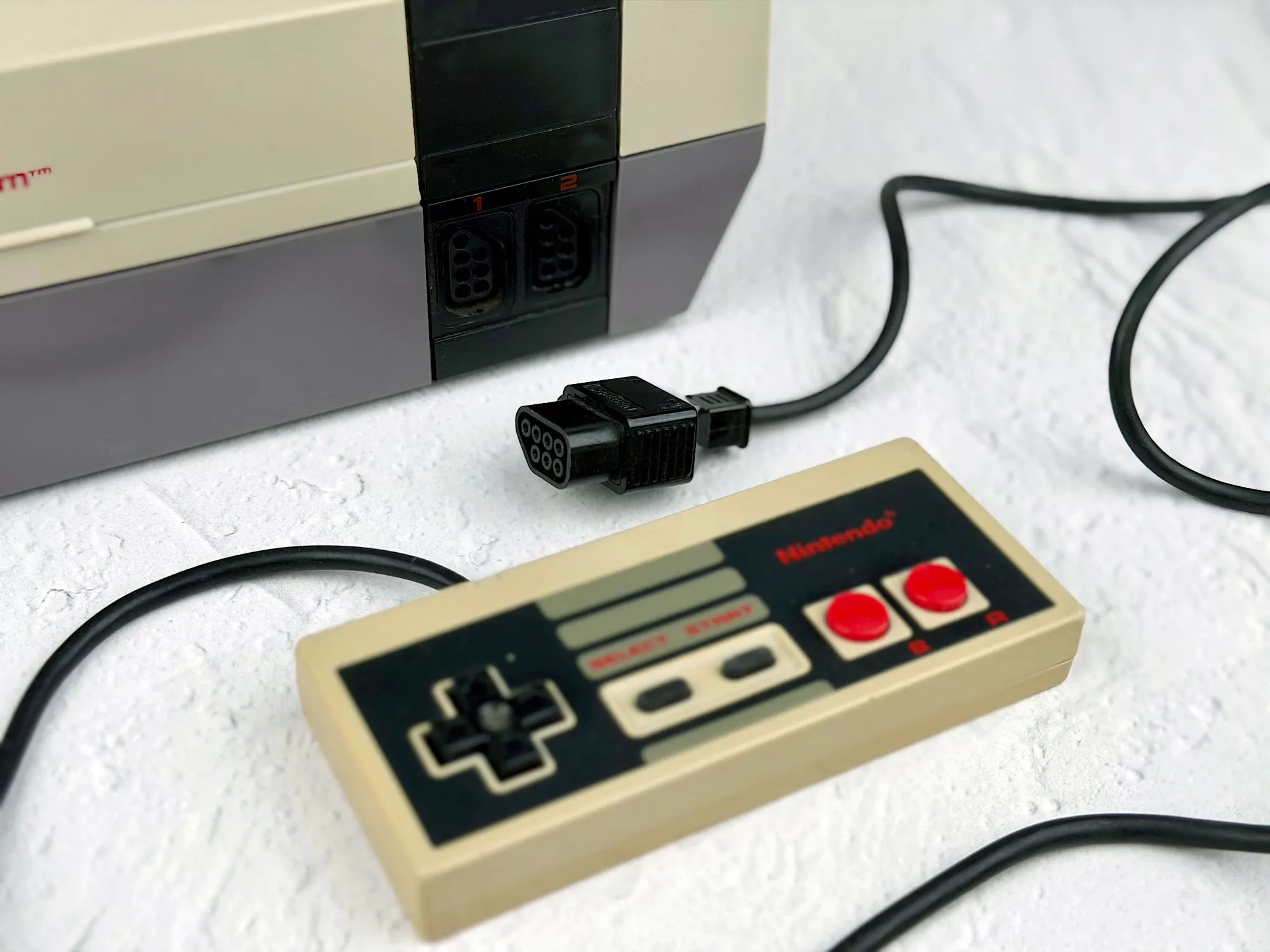 NES — controller ports and a detachable cable NES — controller ports and a detachable cable